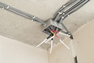 open electrical junction box and wires on the ceiling