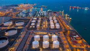 Aerial view oil and gas terminal storage tank farm,Tank farm storage chemical petroleum petrochemical refinery product, Business commercial trade fuel and energy transport by tanker vessel.