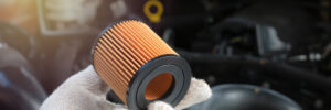 Car mechanic replace the fuel filter