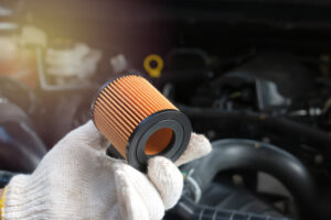 Car mechanic replace the fuel filter