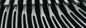 Cooling fins of old aluminium heat sink close-up. Fins from the old processor heat sink. Abstraction.