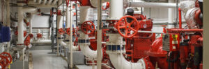 Fire safety in industry. The valve for water supply, fire extinguishing system and pipeline control is painted red