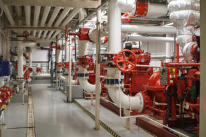 Fire safety in industry. The valve for water supply, fire extinguishing system and pipeline control is painted red