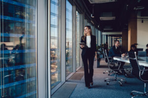 Female administrator walking by window