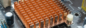 Close up view of copper heat sink or radiator on computer motherboard