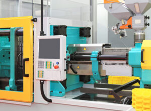 Injection molding machine for plastic parts production