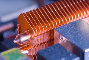 Copper heat pipe with dissipating fins on computer motherboard